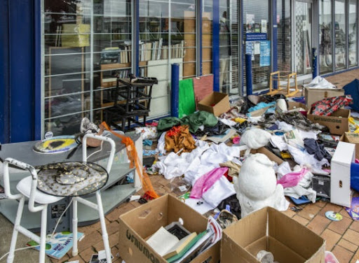 Donations, being left outside The Salvation Army Family Store on Botany Rd, are being strewn about as people help themselves on day 4 of Covid 19 Level 4 Lockdown in New Zealand.