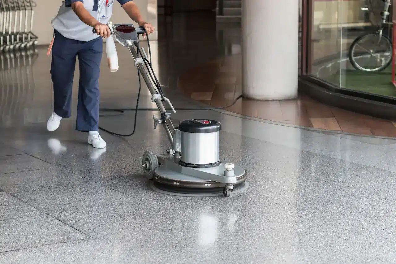 Woman Worker Cleaning the Floor with Polishing Machine 