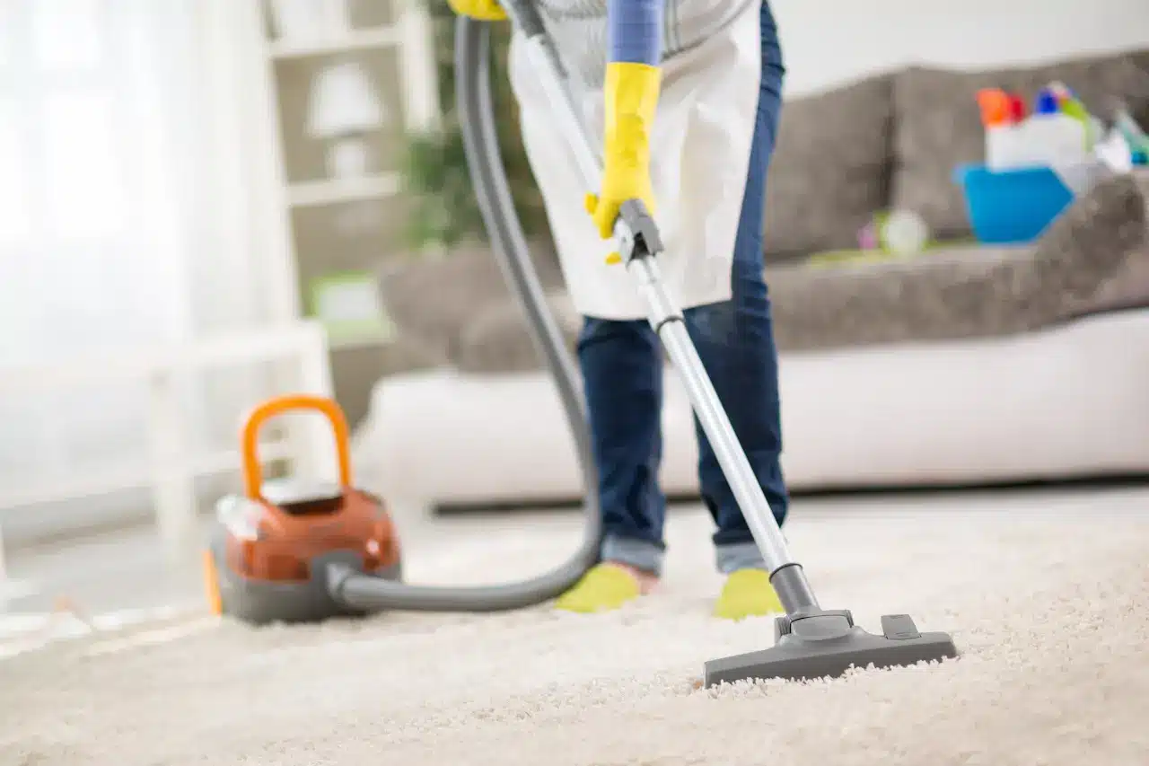 A Woman Vacuuming the Floor